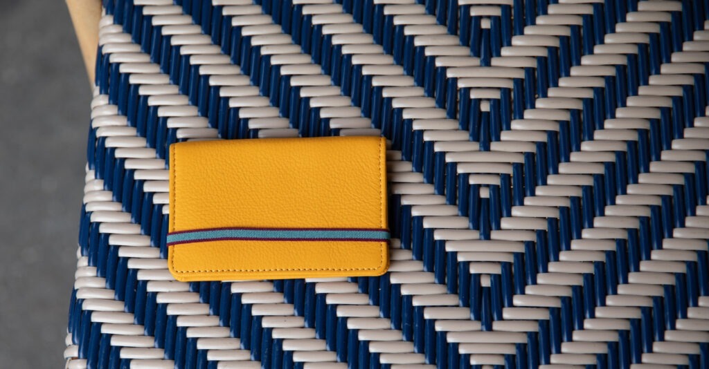 wallet. Available in black, yellow, orange, red, blue, navy.